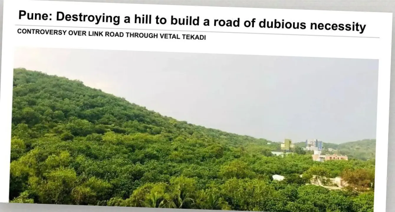 News clipping on a road through Vetal tekdi above a photo of the forested hill